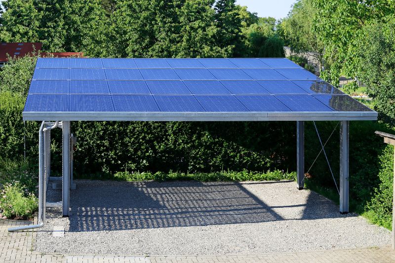 free standing carport with solar panels on the roof