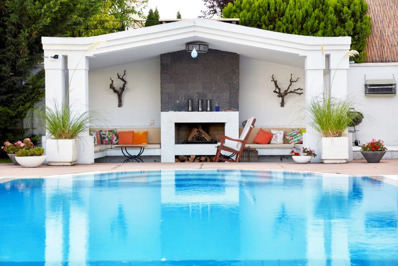 pool deck with a stylish sitting area